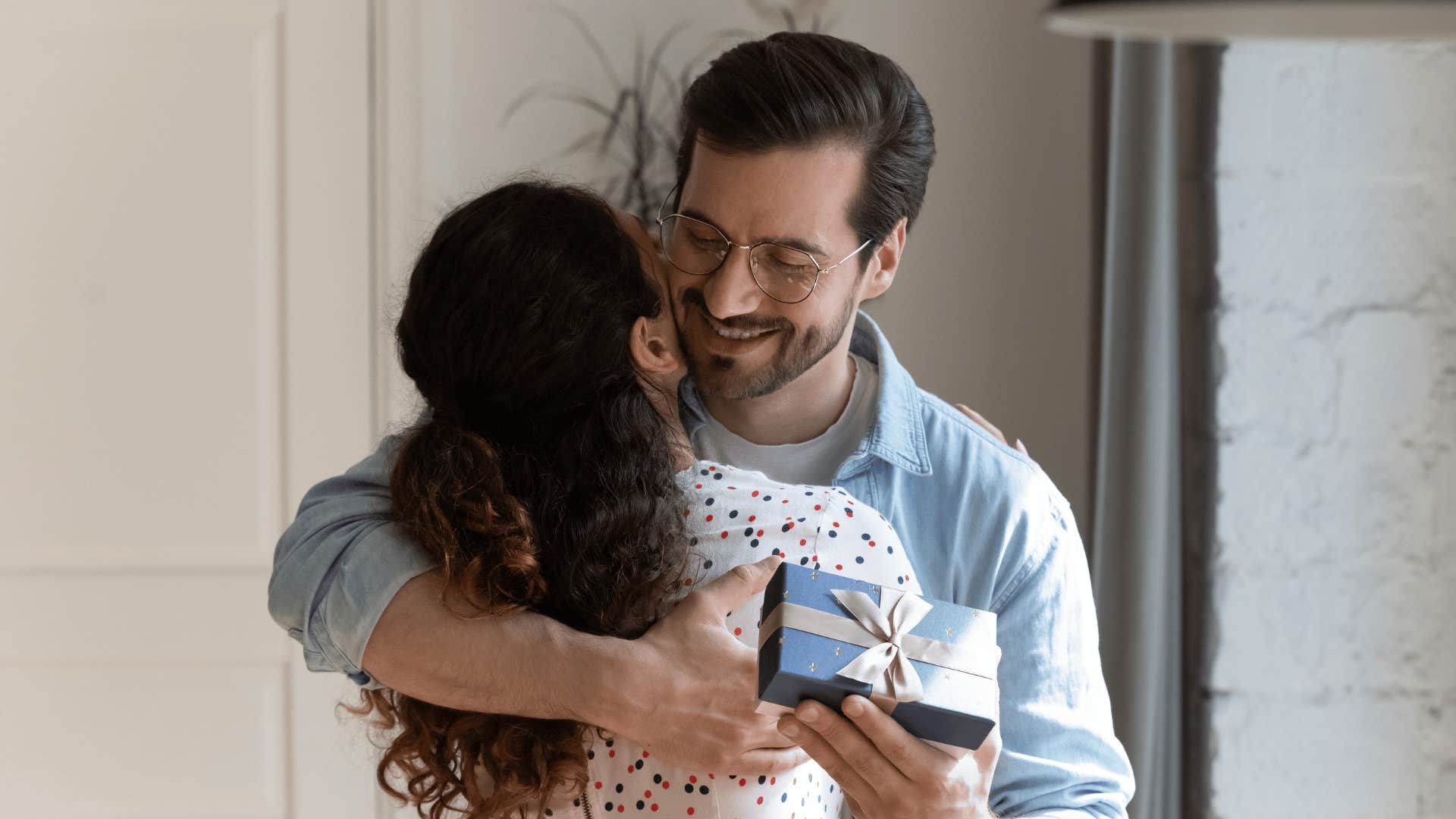 man giving woman gift