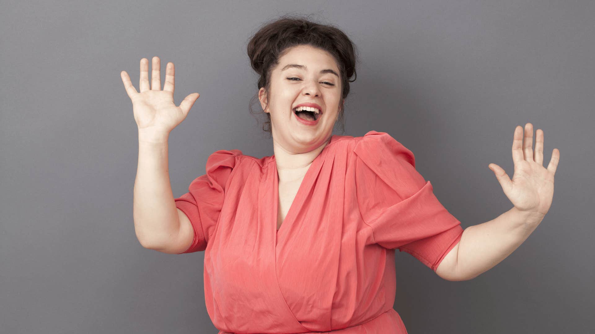 woman dancing and smiling