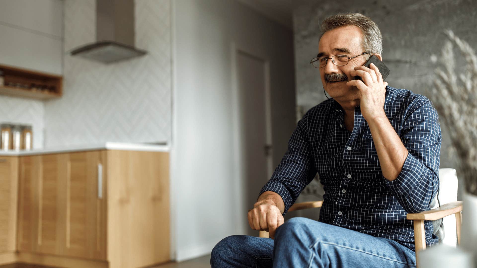 Older man talks on telephone