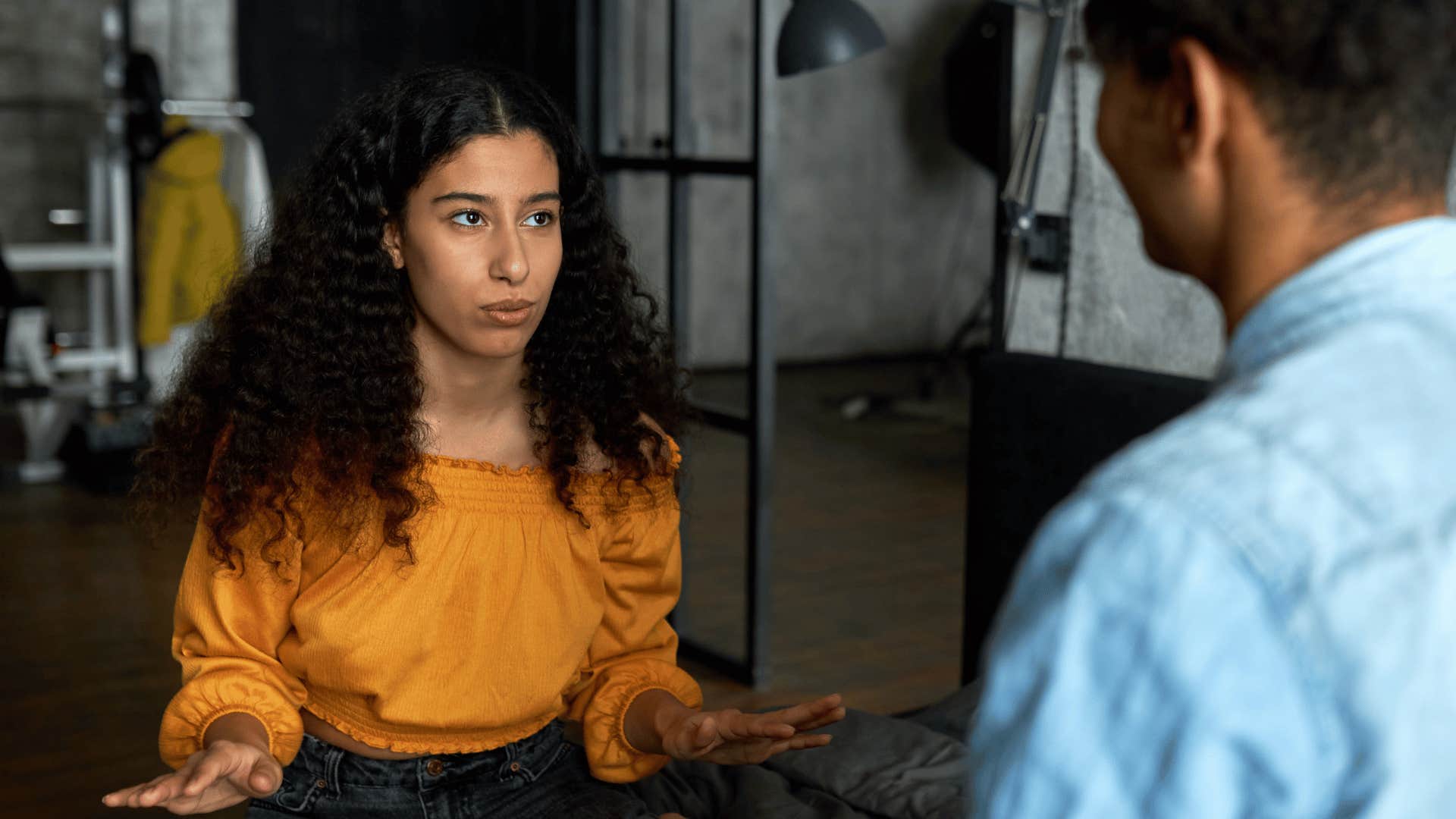 woman talking to man while sitting