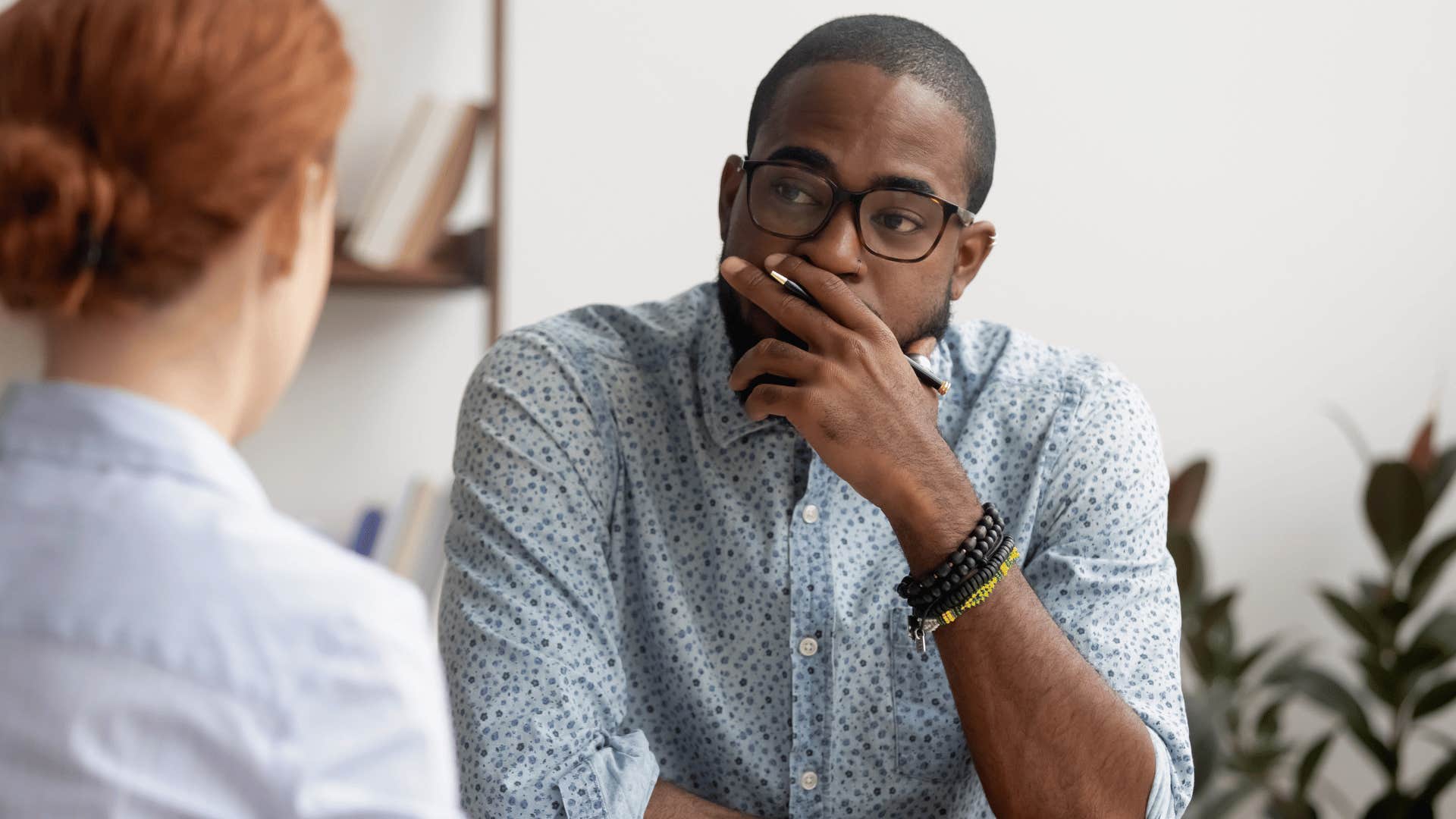 man listening to woman 