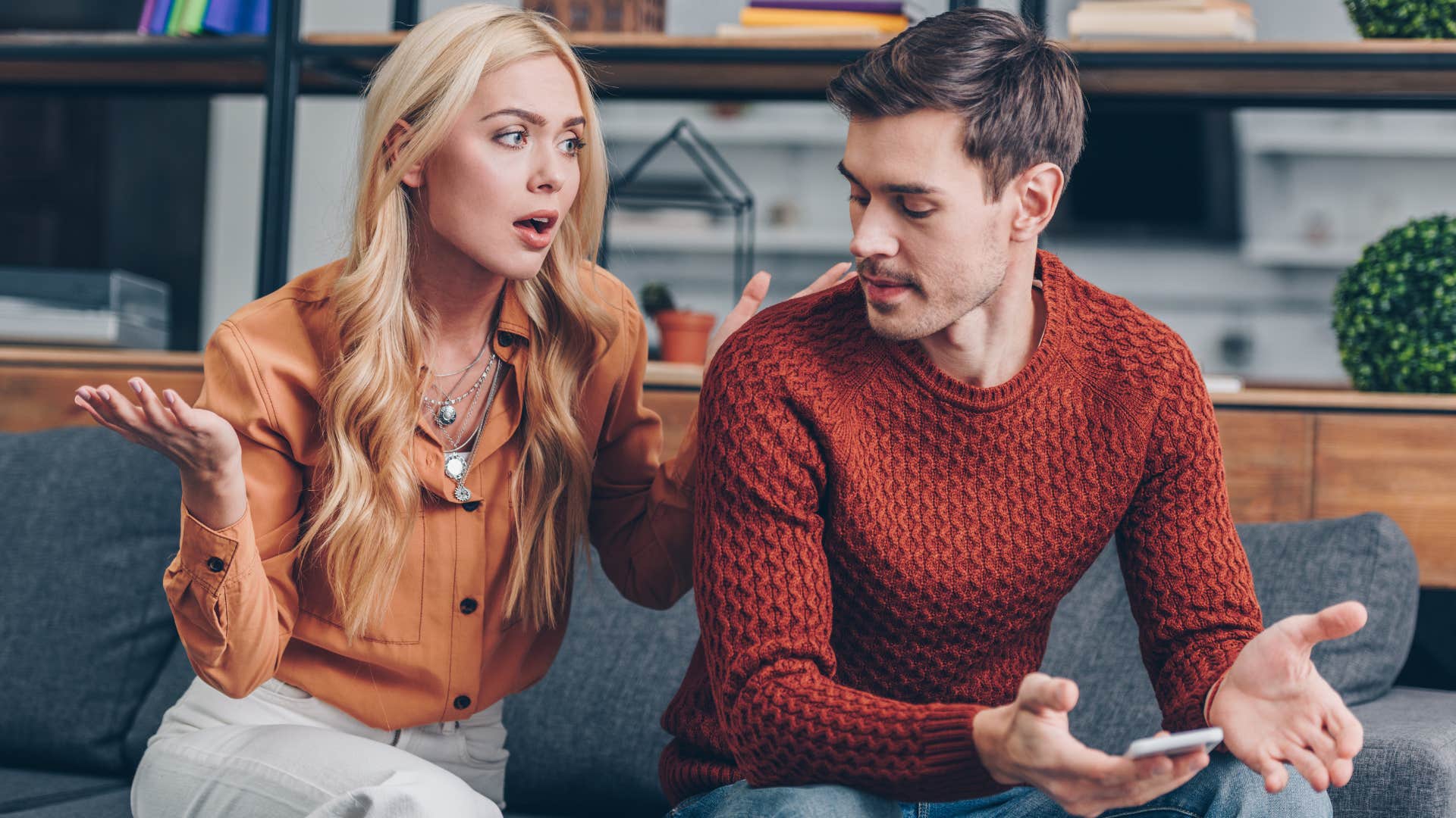 Woman arguing with her husband on a coach.