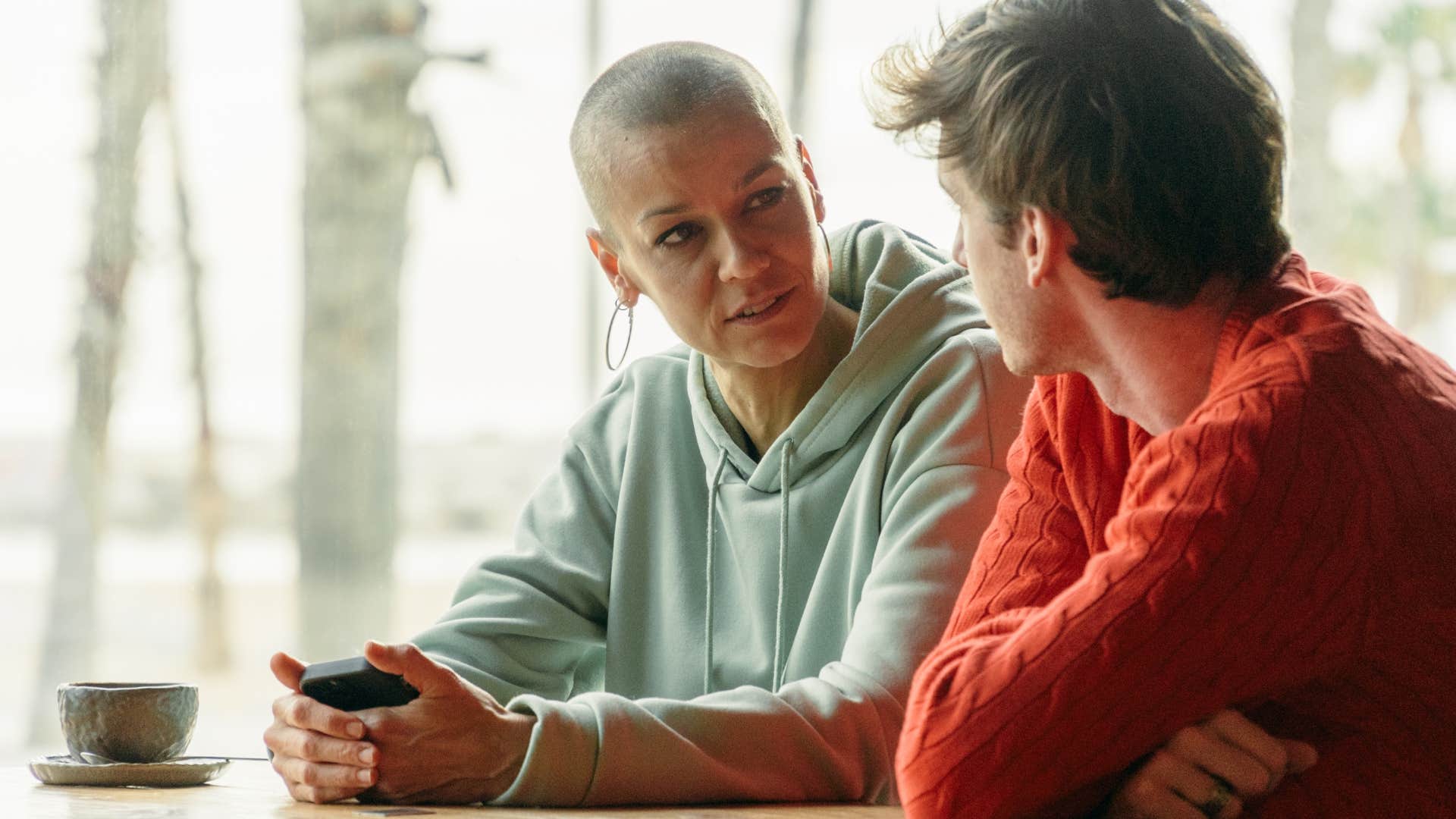 Woman talking seriously to a young man