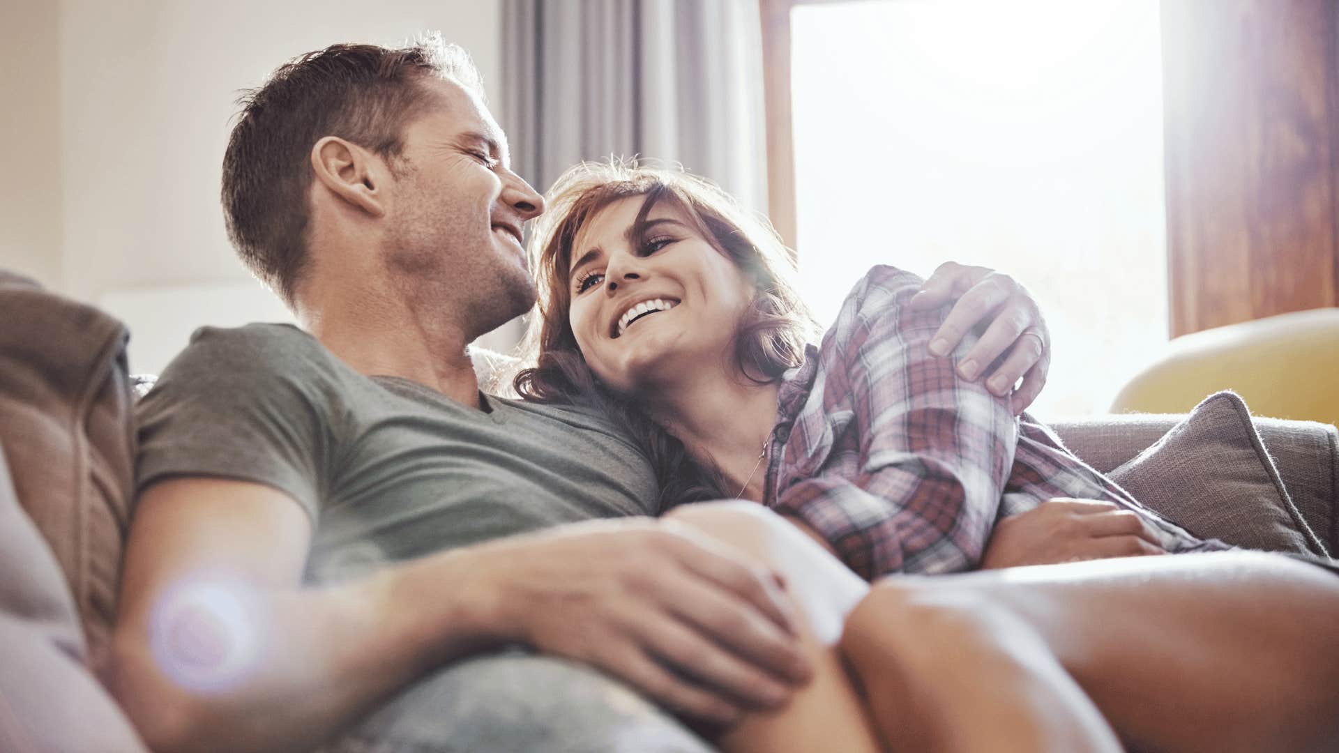 happy couple on couch