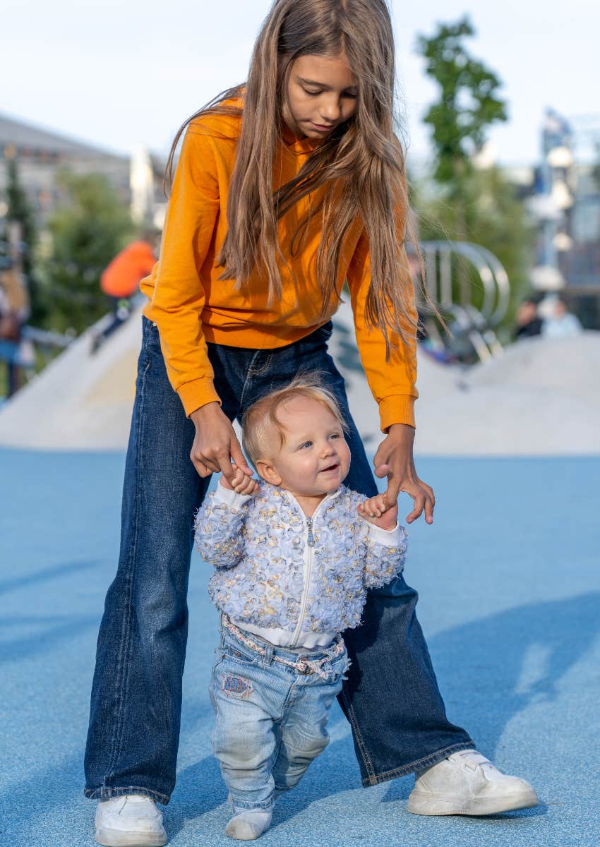 Child caring for younger sibling