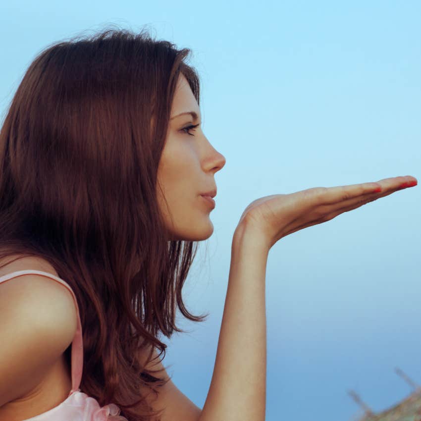 woman blowing cinnamon into her home