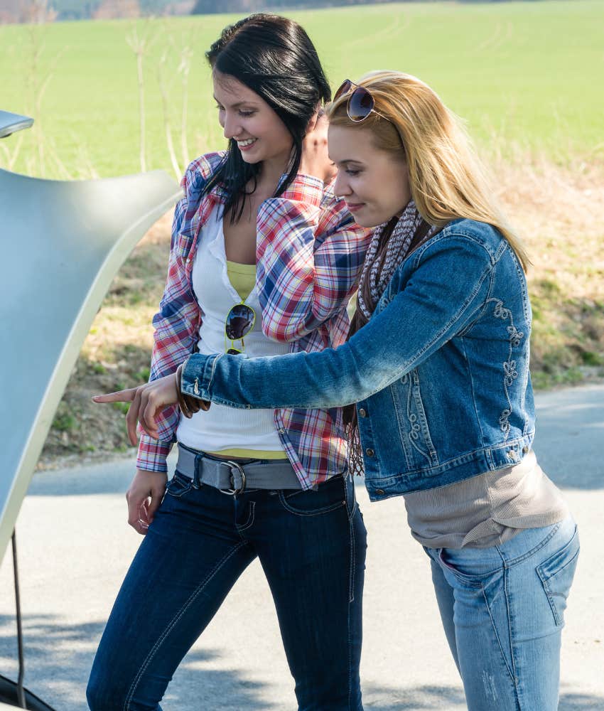 Two women packing up their car for a road trip