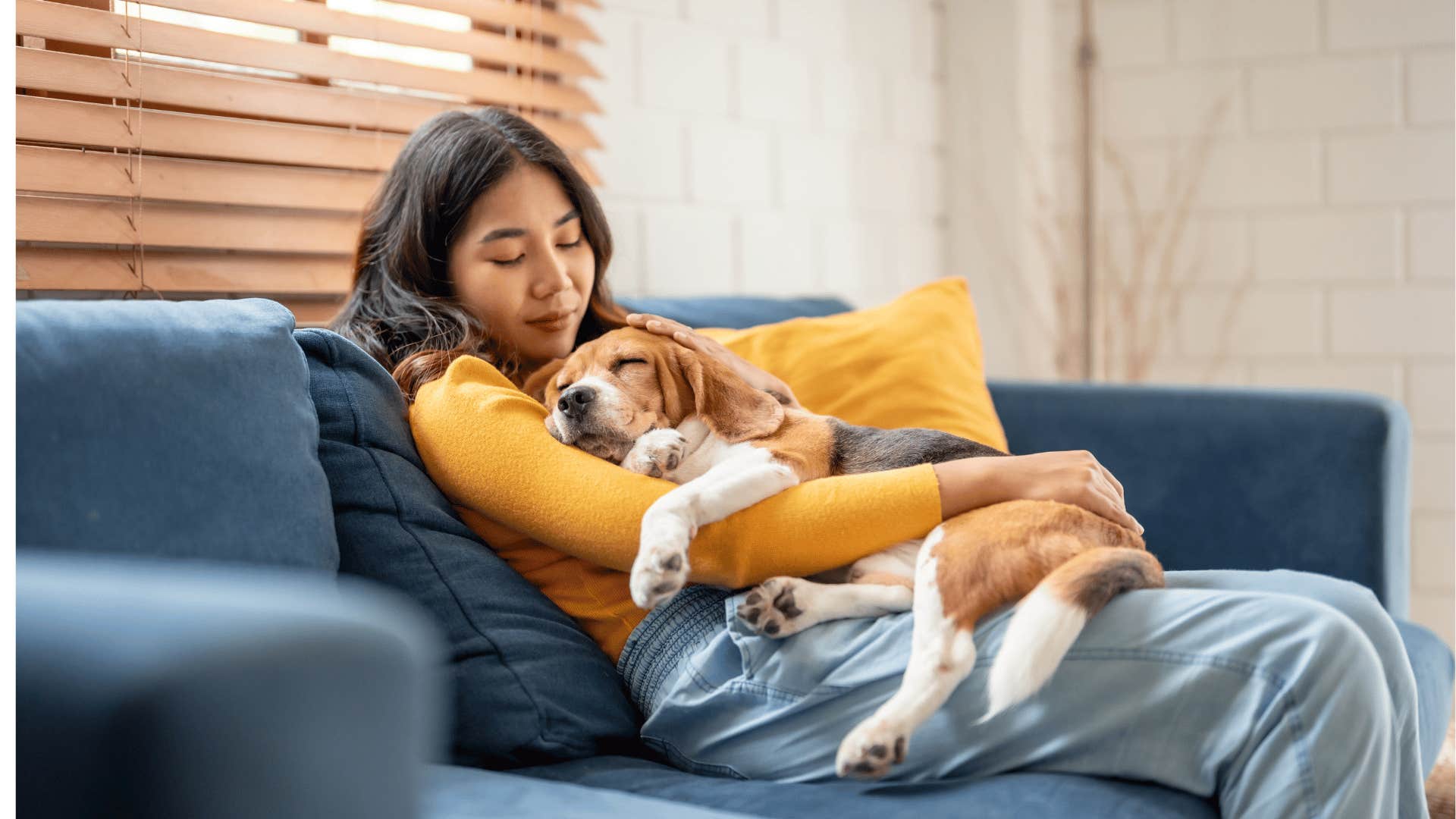 Woman cuddles dog because her emotional needs are ignored by her spouse