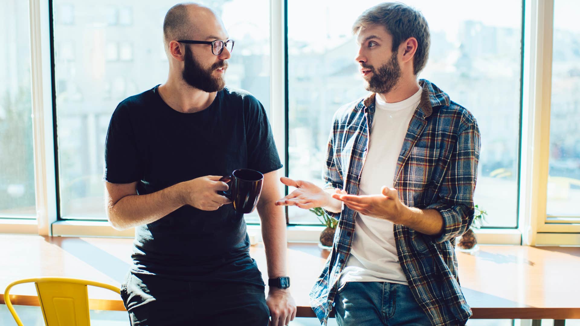 Two men arguing with each other.