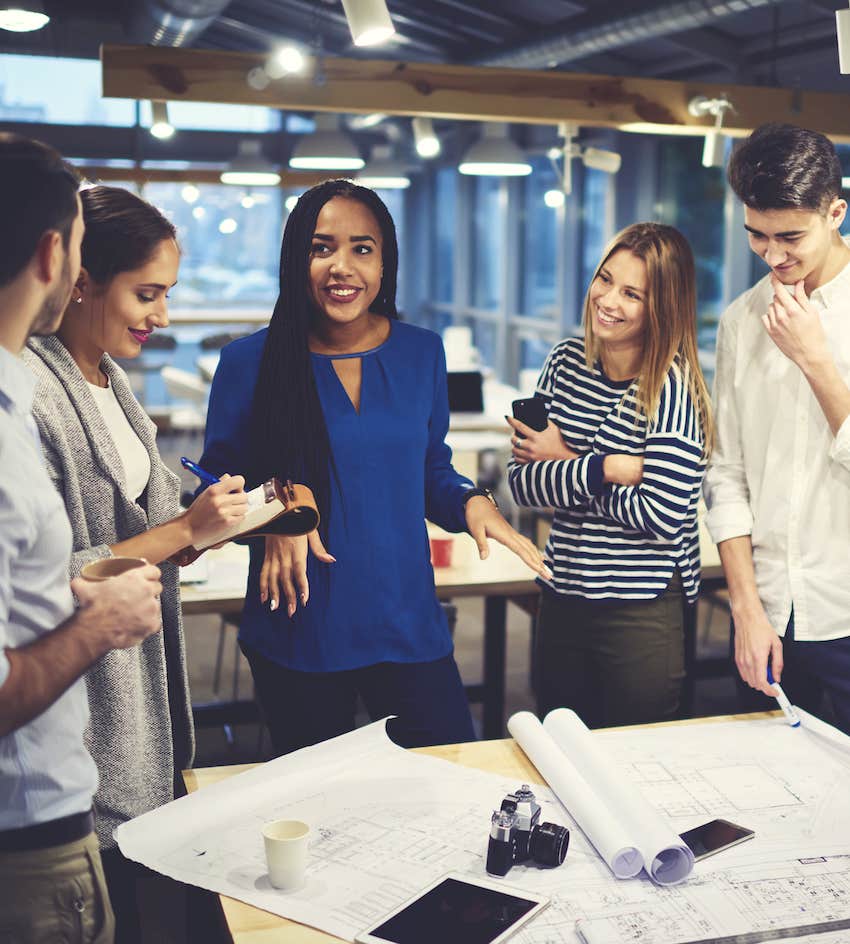 Woman talks with colleagues after landing a great job opportunity