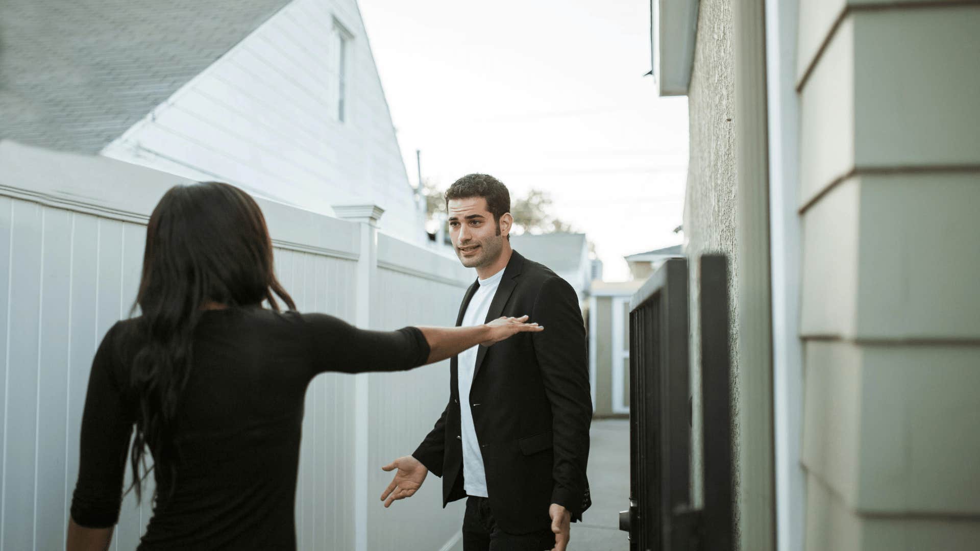 man and woman arguing outside