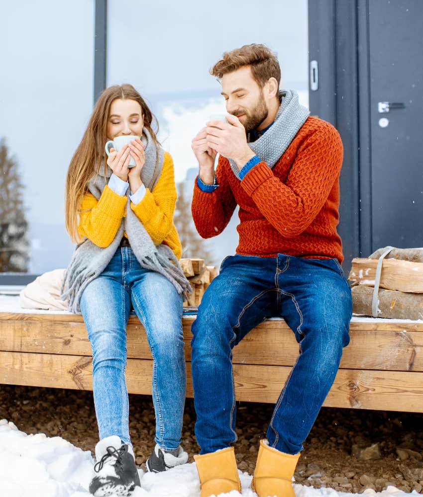 snowy scene of couple talking over coffee