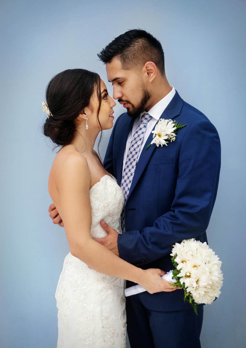 bride and groom standing next to each other