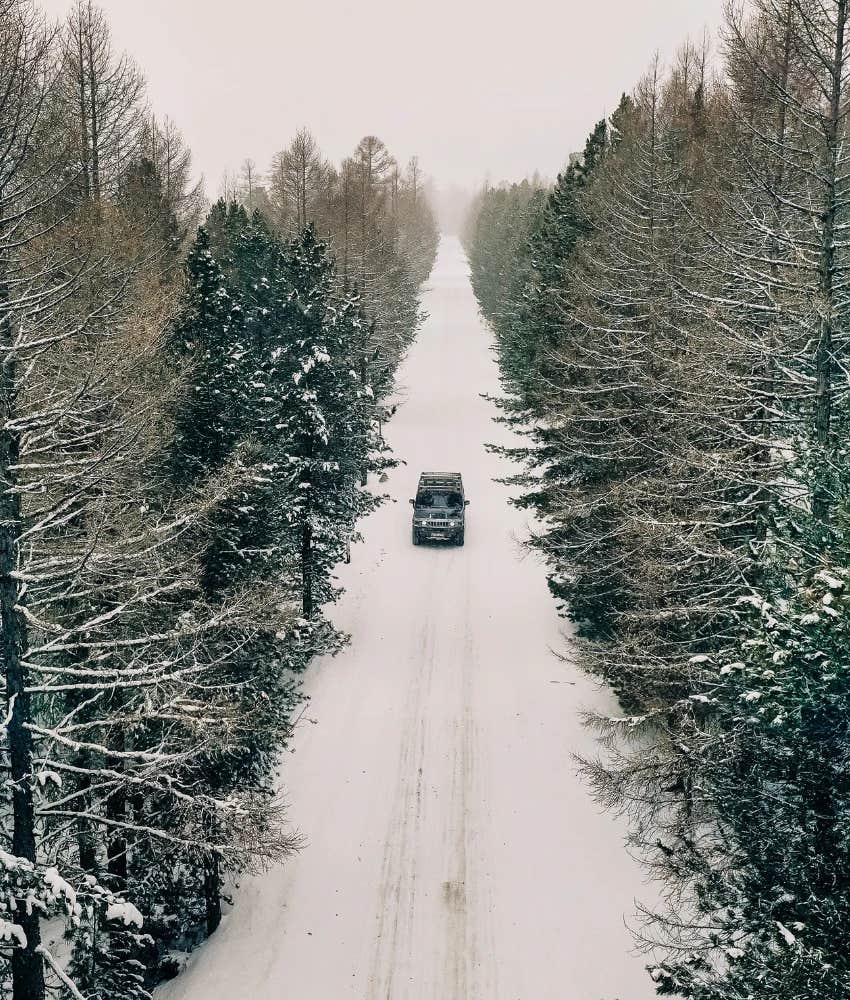 Woman driving through a blizzard to get to work