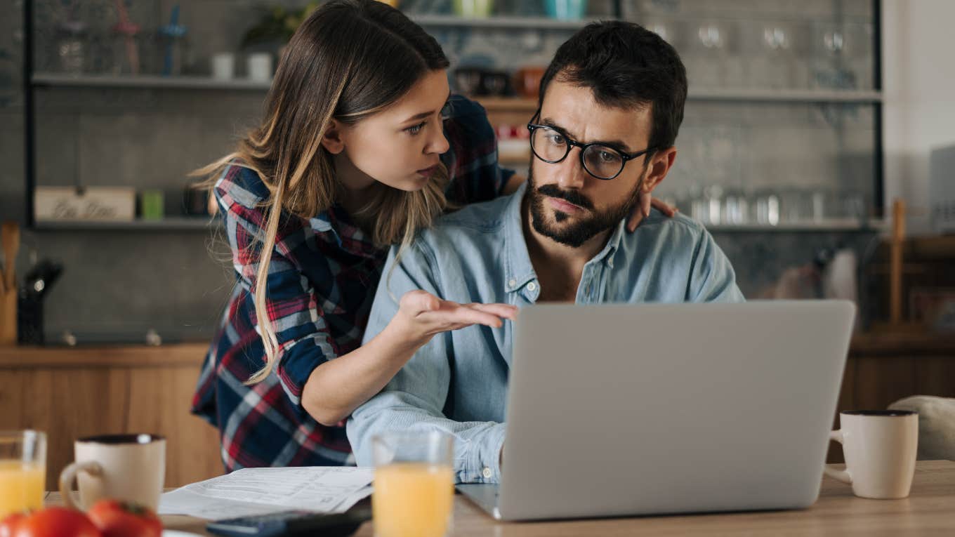 Man and woman looking at their spending