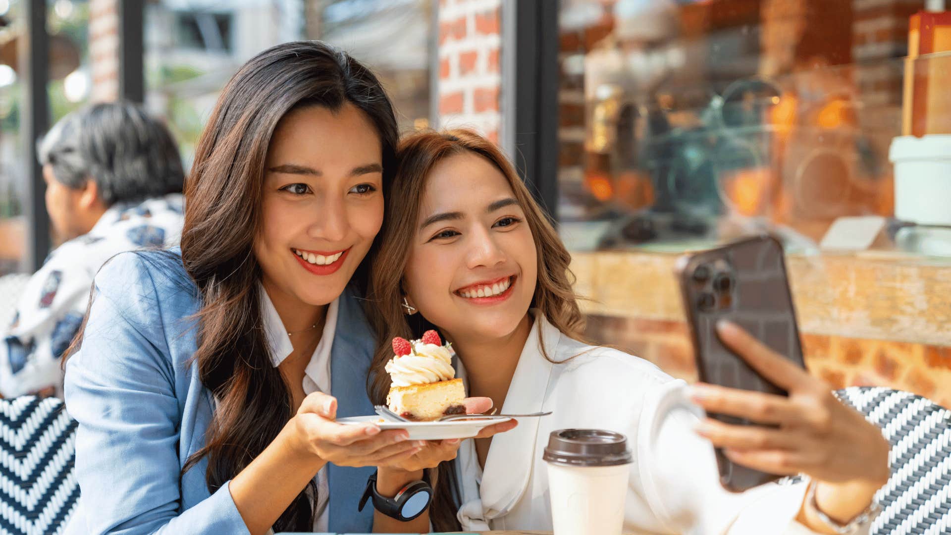 Couples takes selfie with cake as an act of shared kindness