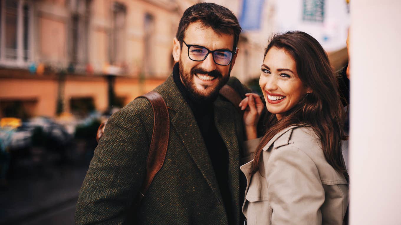 Couple flirting casually after bumping into one another on the street. 