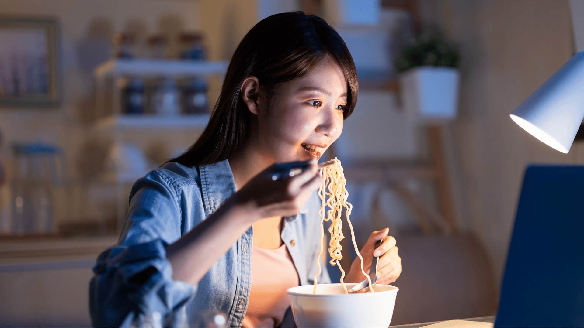 woman eating noodles