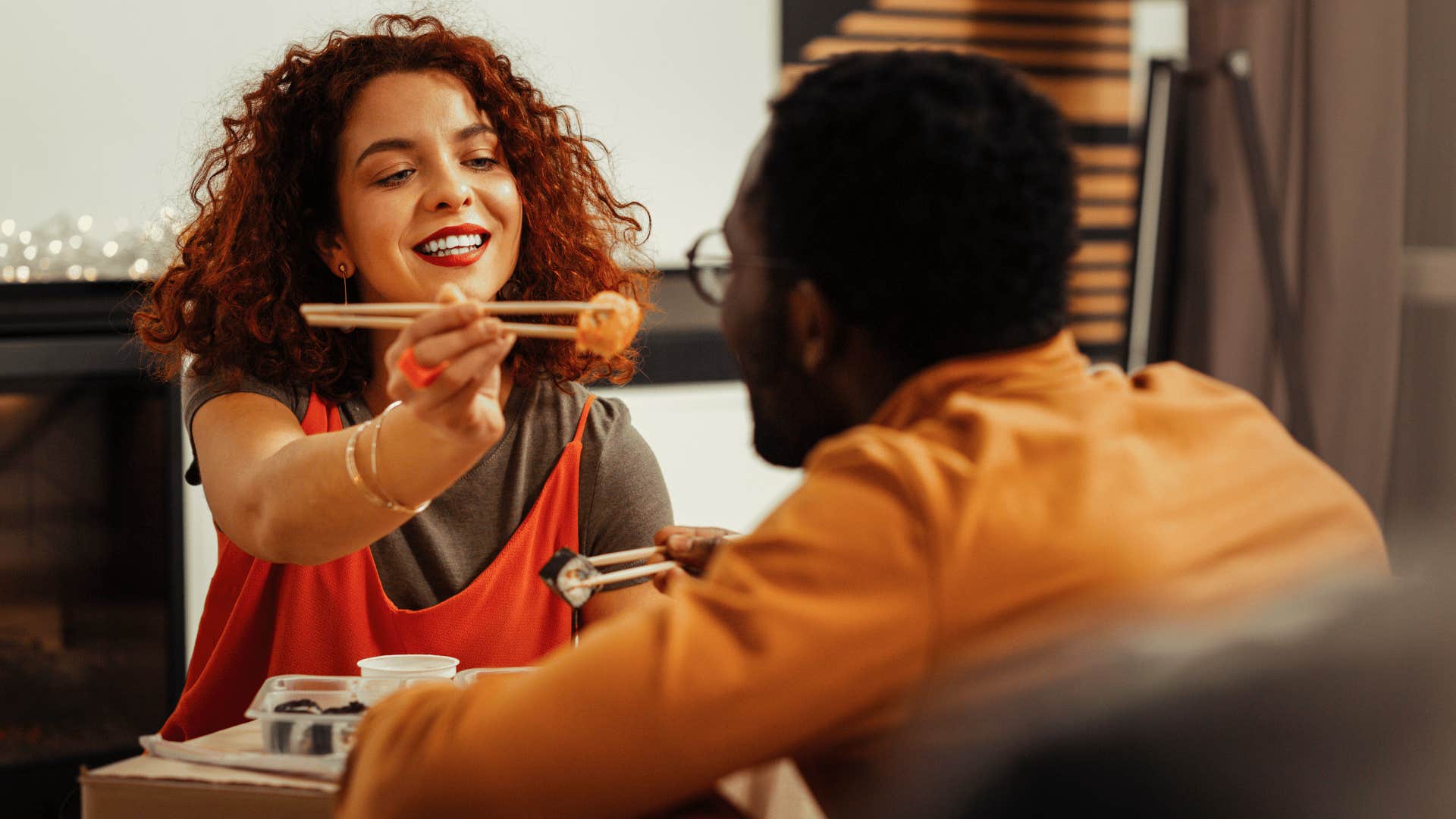 woman feeding man