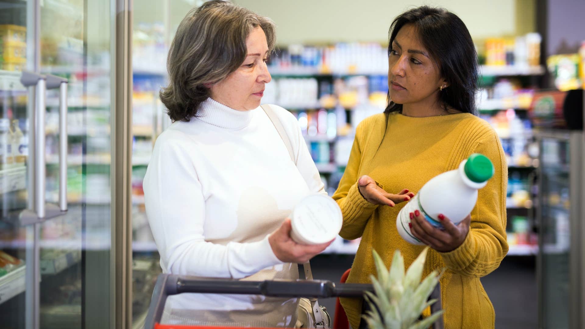 Two women talking in the grocery store