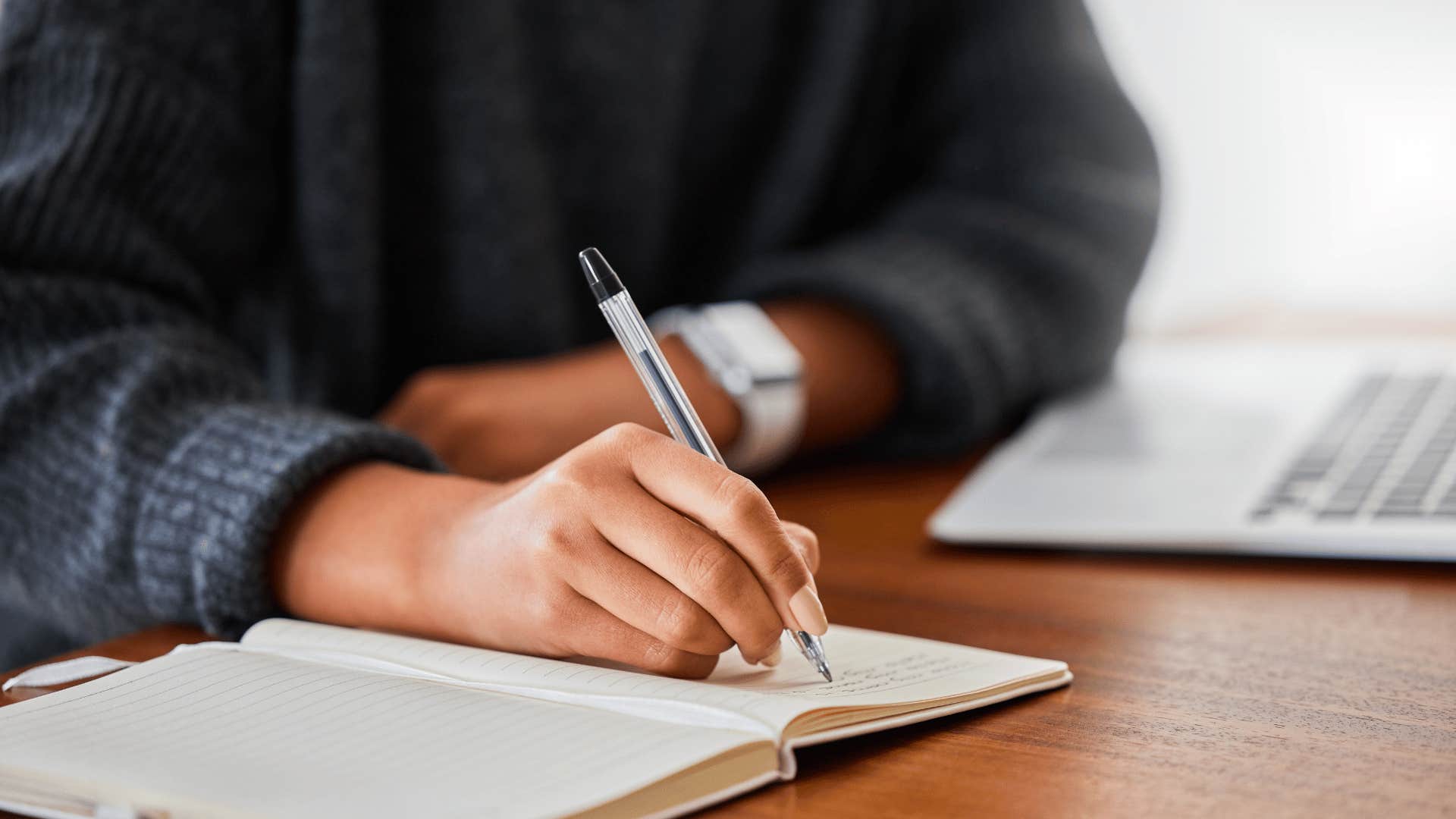 woman taking notes