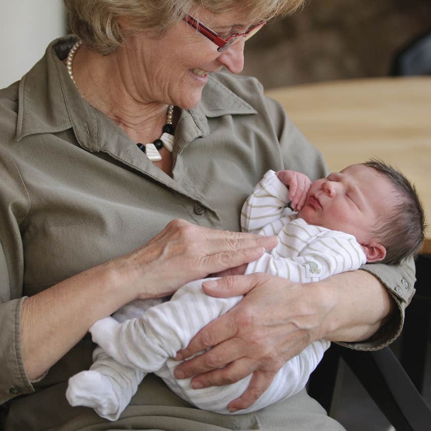 Mother-in-law holding newborn granddaughter