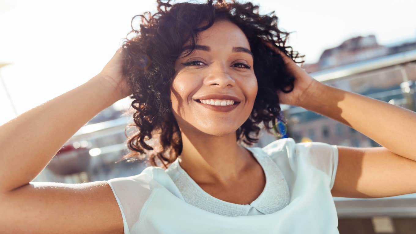 carefree woman with hands in her hair