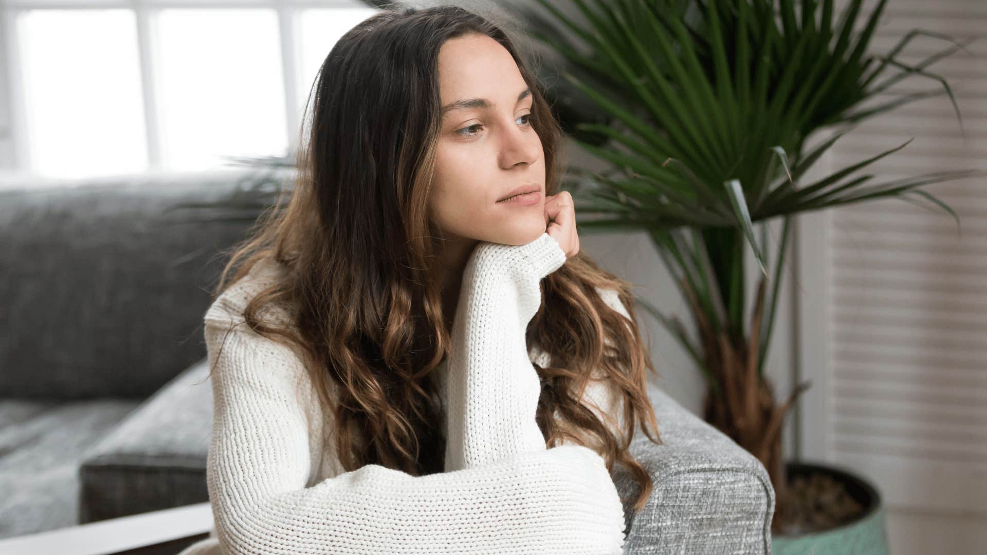 woman looking out window