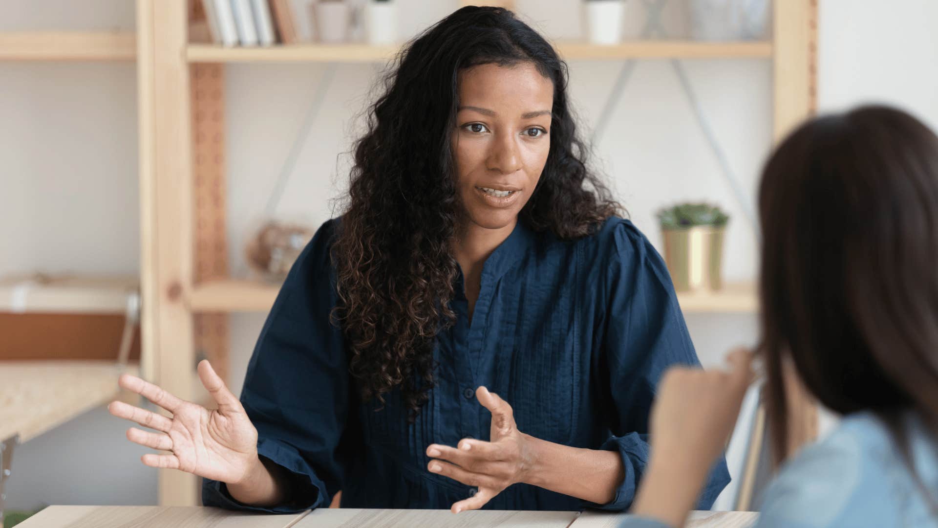 woman talking to other woman seriously 