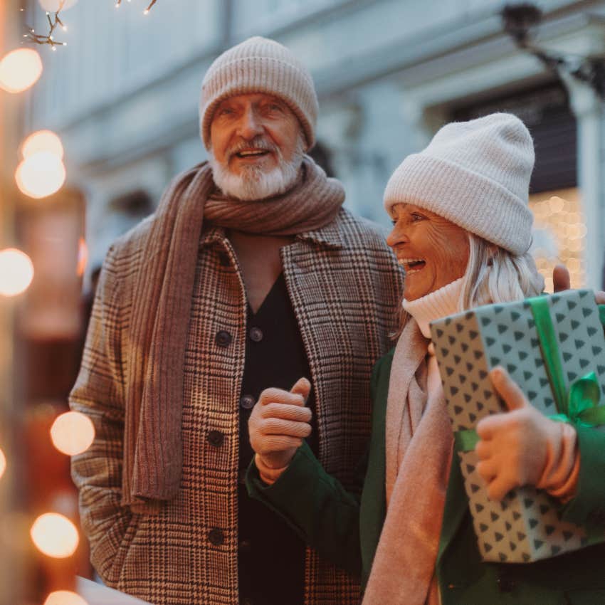 Happy senior couple looking at Christmas lights