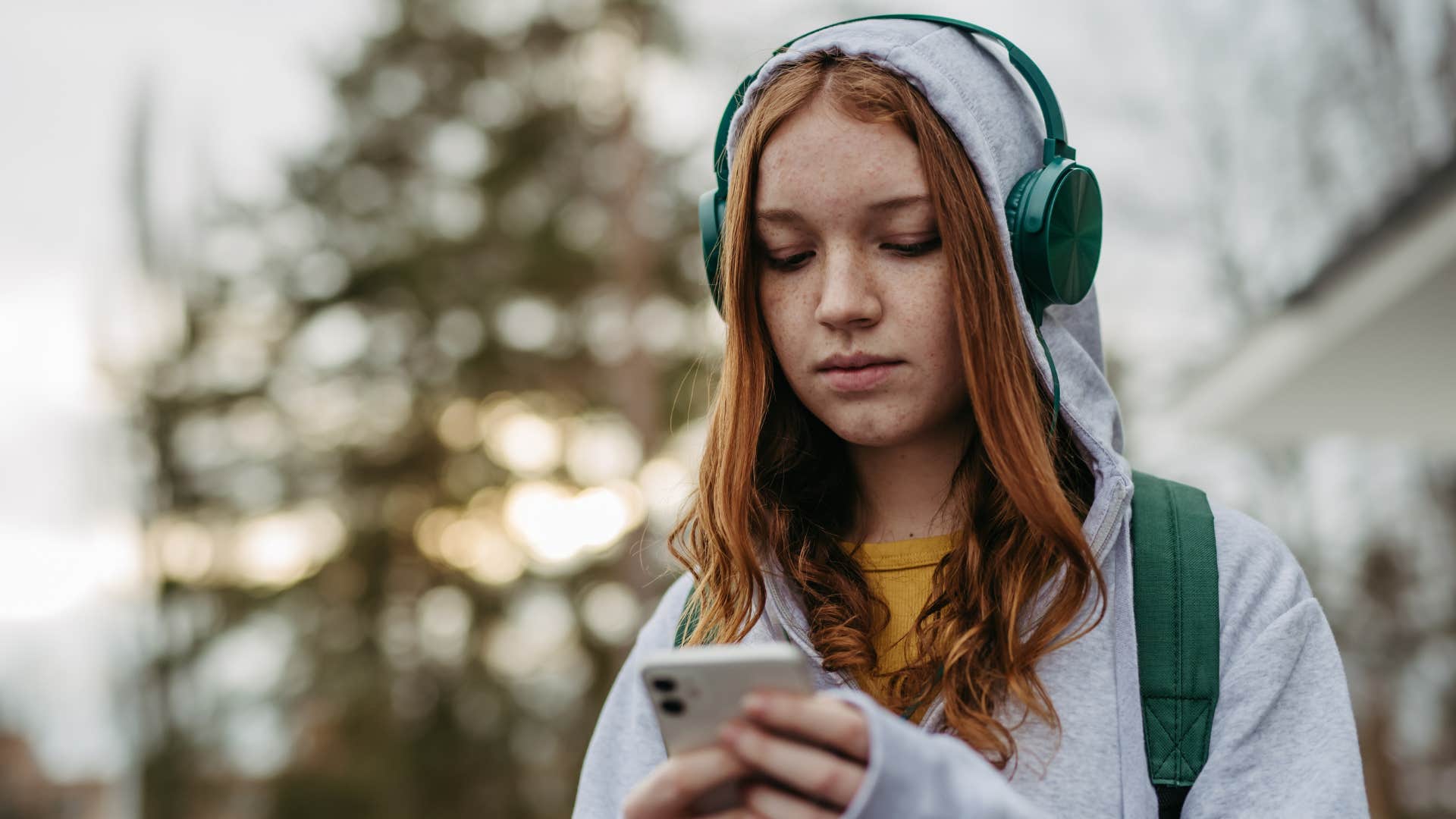 Young girl texting on her phone.