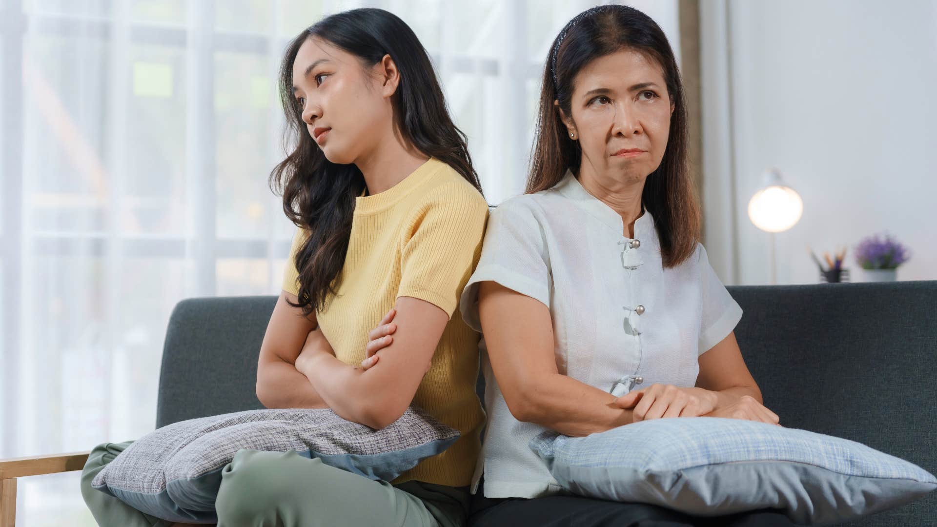 Woman turned away from her upset mother.