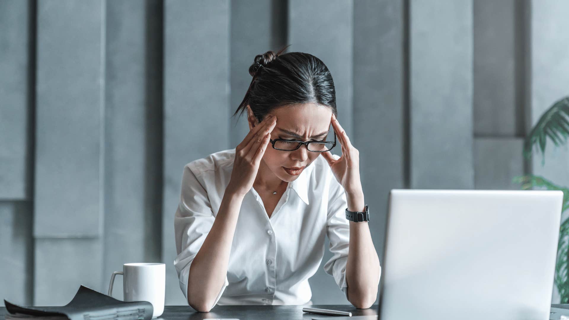 woman upset in front of computer