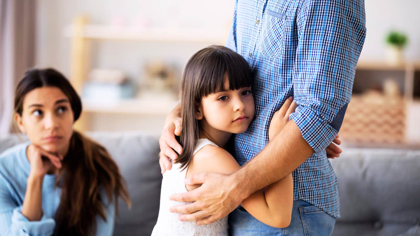 Parents protecting child against the pain of divorce. 