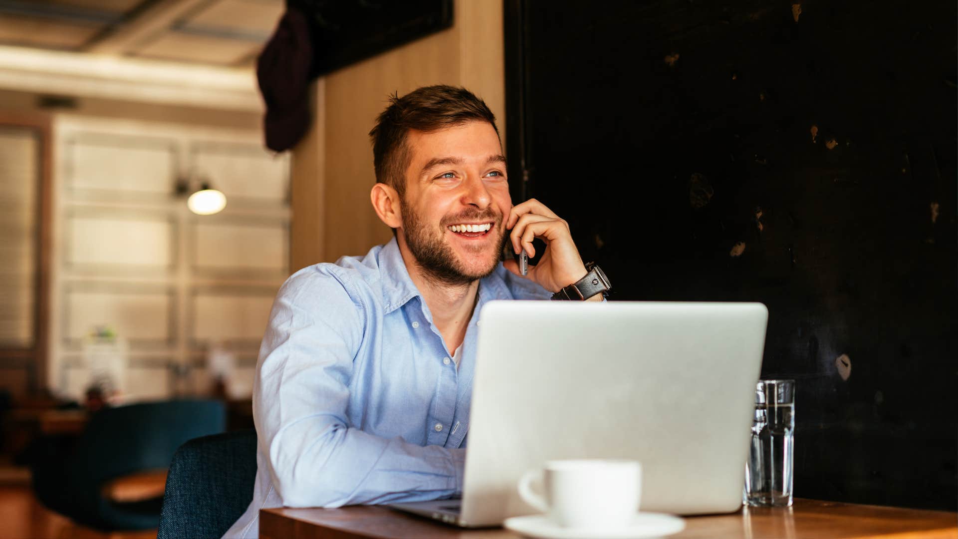 Handsome businessman talking to the clients.