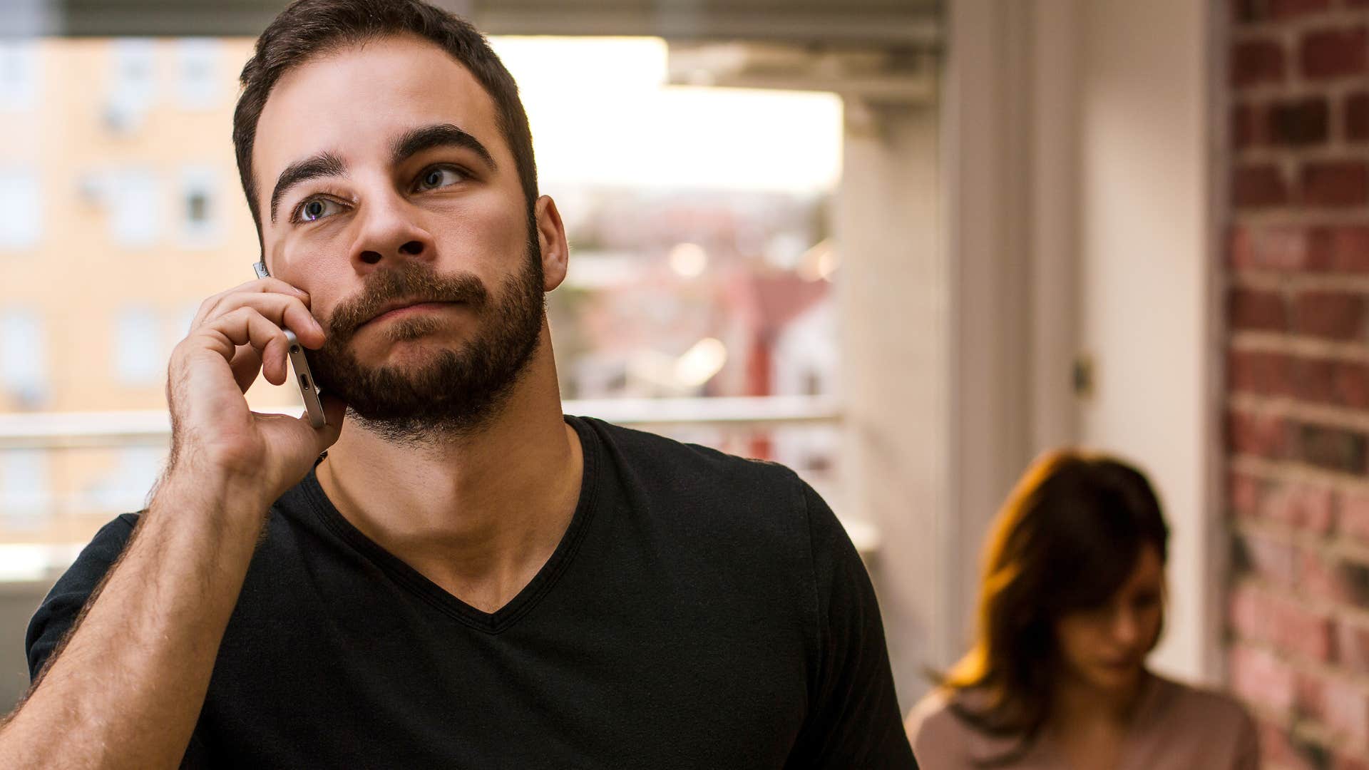 Stressed man talking on phone