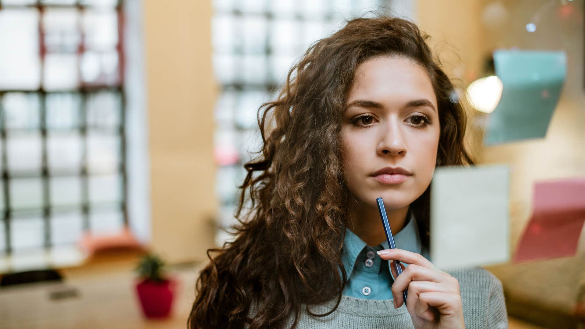 Concentrated woman making plan on sticky notes