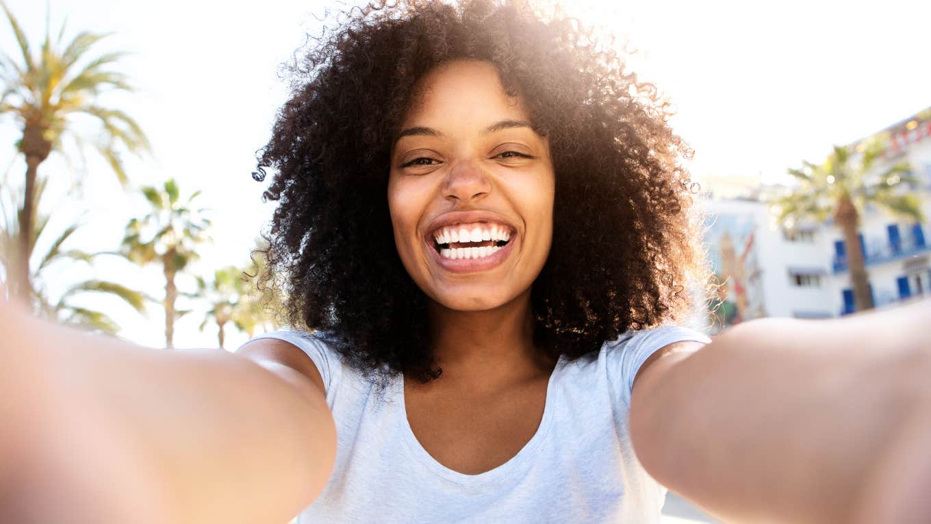 Intelligent woman handling her worries with a smile. 