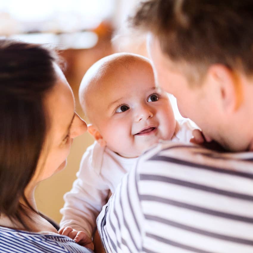 Parents holding their baby