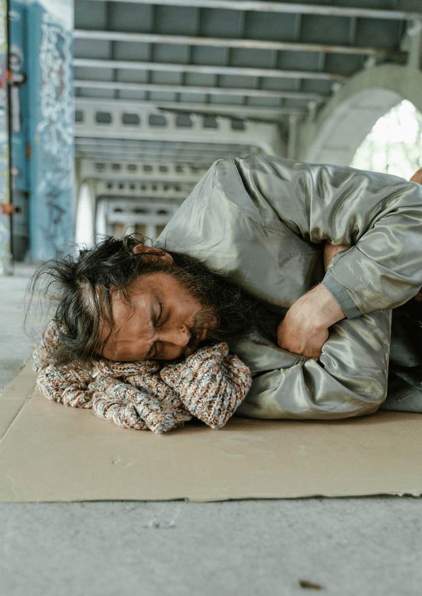 homeless man sleeping on the floor