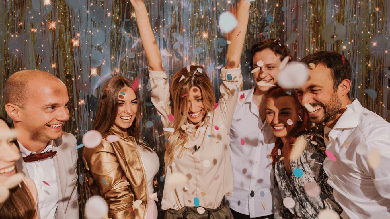 group of friends celebrating new year's eve resolutions successful astrology