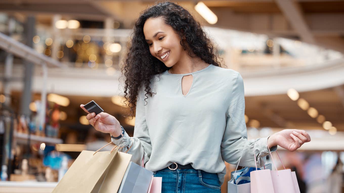 Woman shopping holding bags and credit card