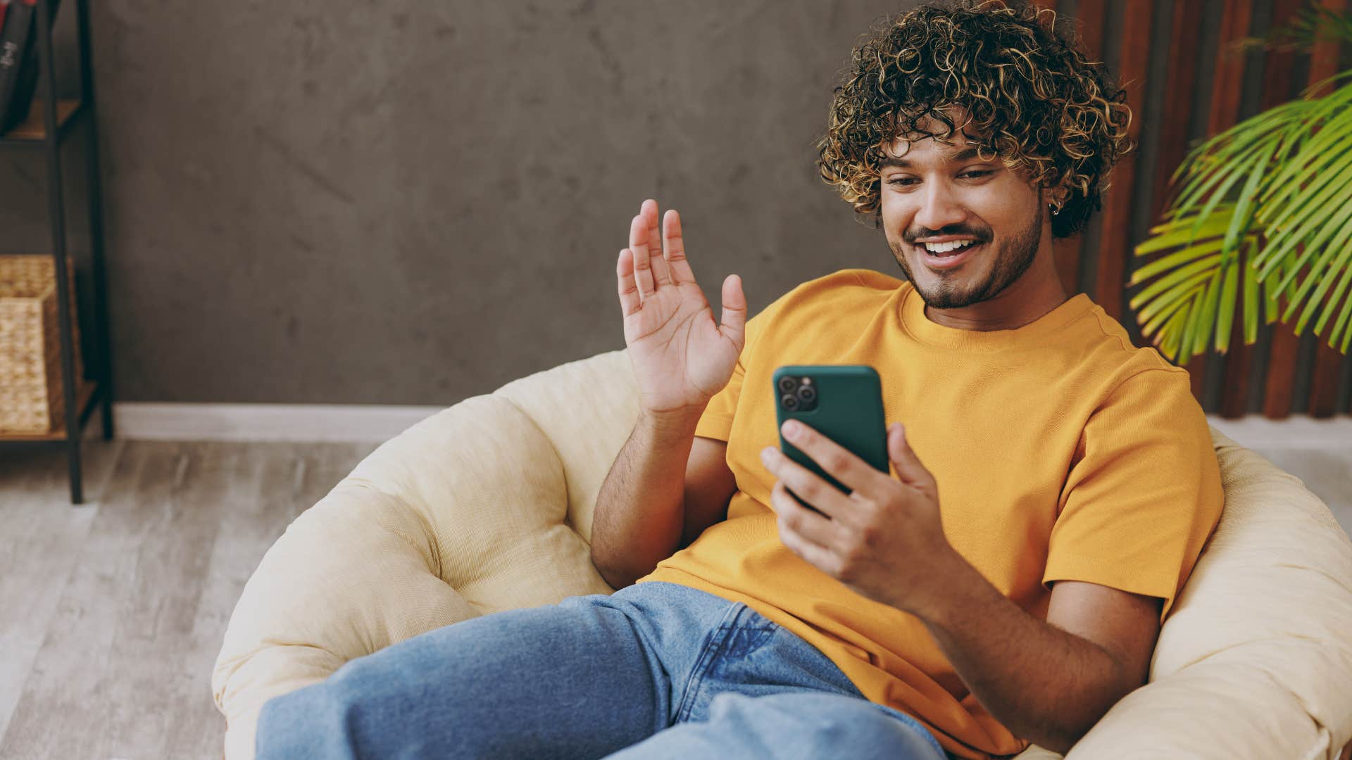 Man smiling and relaxing at home.