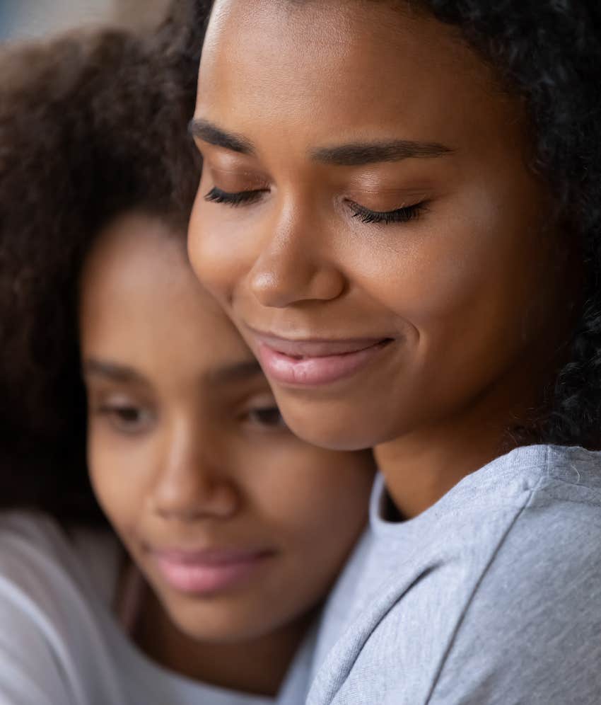 Emotionally resilient woman comforts girl