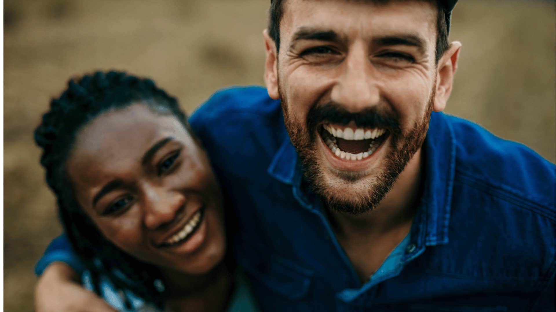 Happy couple laugh together