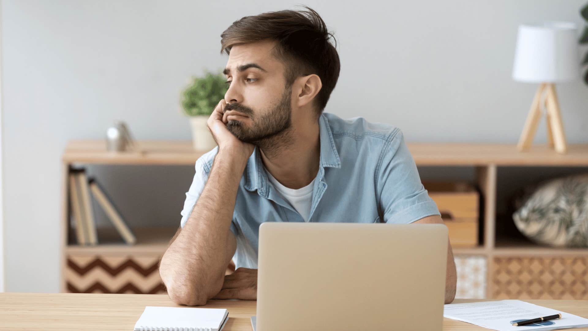 bored man on laptop