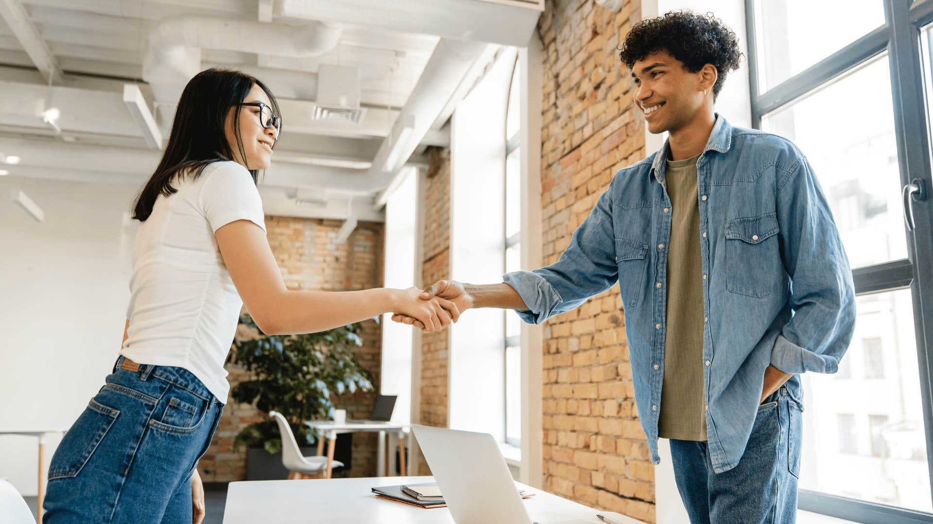 man and woman shaking hands