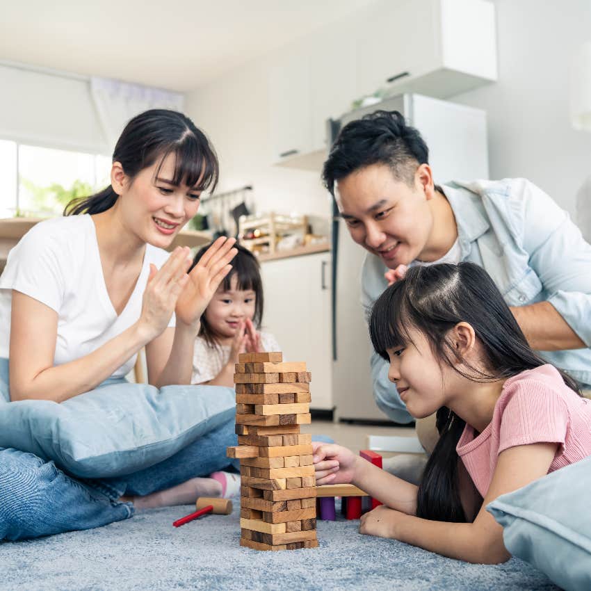 Living room family playing Jenga