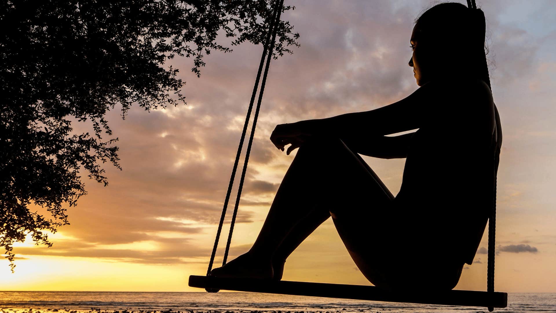 woman sitting on a swing 