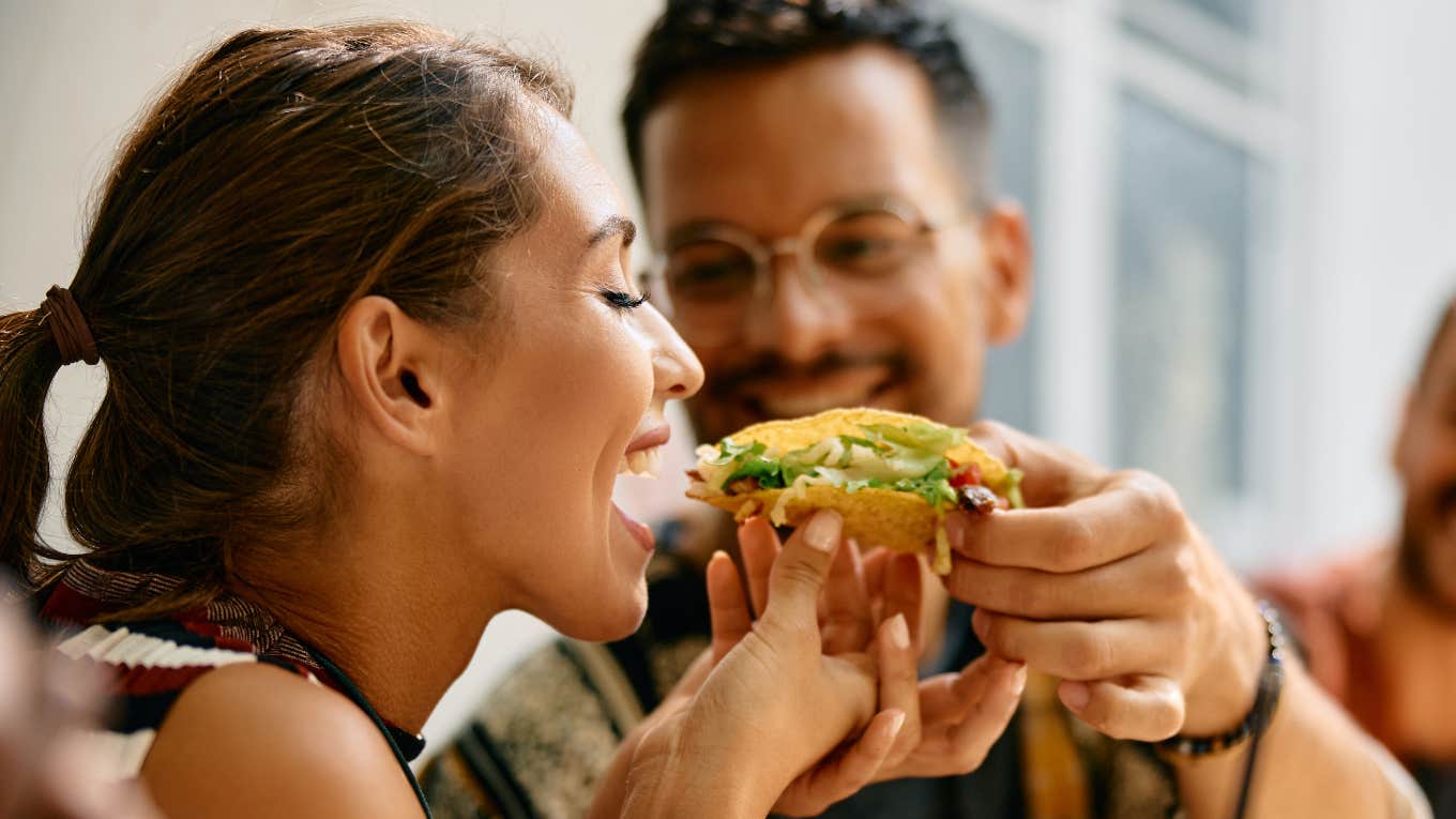 Couple eating tacos on a date